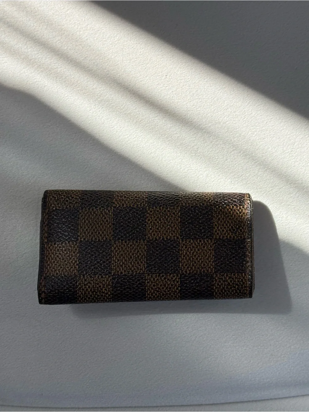 SOLD Louis Vuitton Brown Damier Ebene Canvas Key Pouch with Gold Button